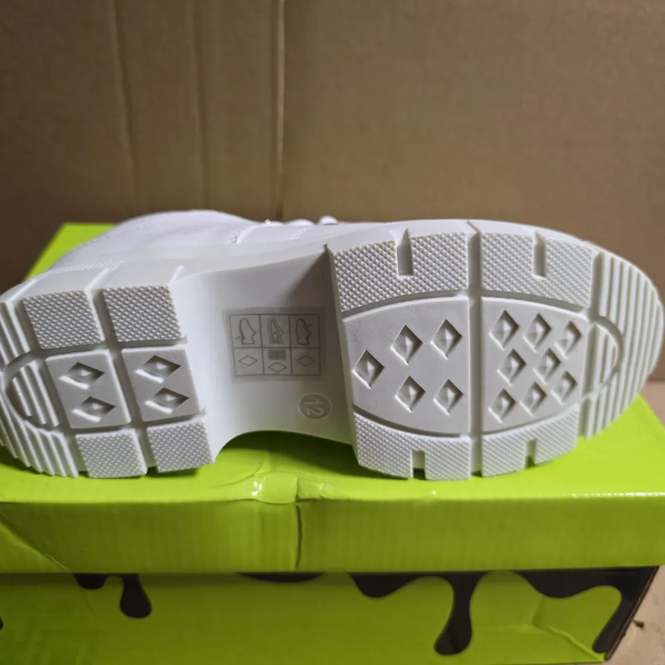 BOXED PAIR OF KOI LIL' RIMO CORE WHITE TRAINERS – UK 12K (KIDS)