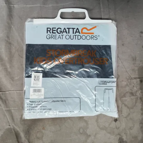 BAGGED REGATTA KID'S STORMBREAK OVERTROUSERS IN NAVY SIZE 11-12 YEARS