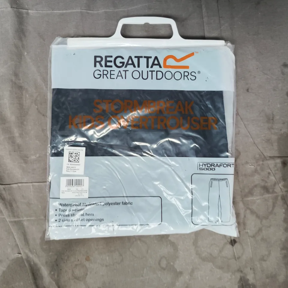BAGGED REGATTA KID'S STORMBREAK OVERTROUSERS IN NAVY SIZE 11-12 YEARS