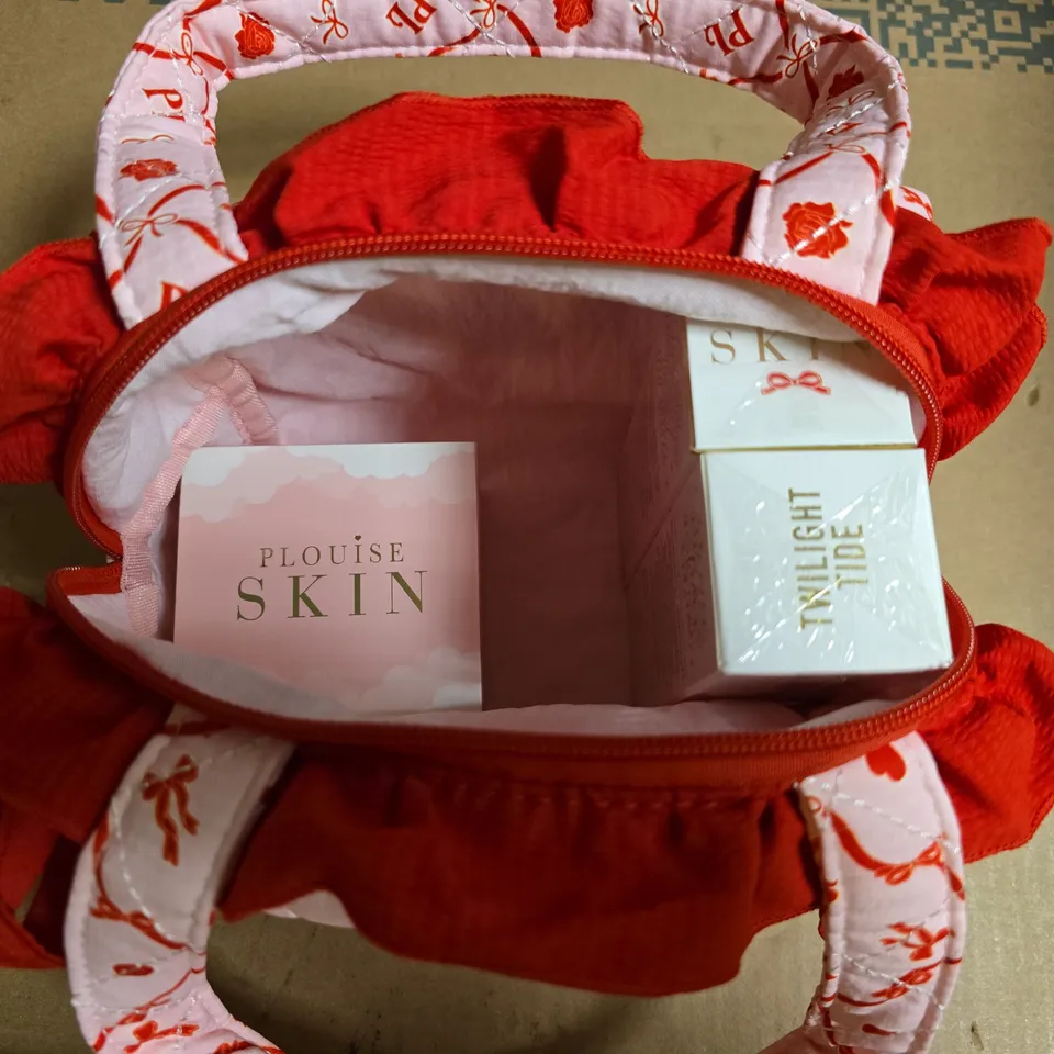 PLOUISE COSMETICS BAG TO INCLUDE SUGAR PLUM LIP CONDITIONER, PURIFYING AND BRIGHTENING LOTION AND LIP DRIP LIP GLOSS