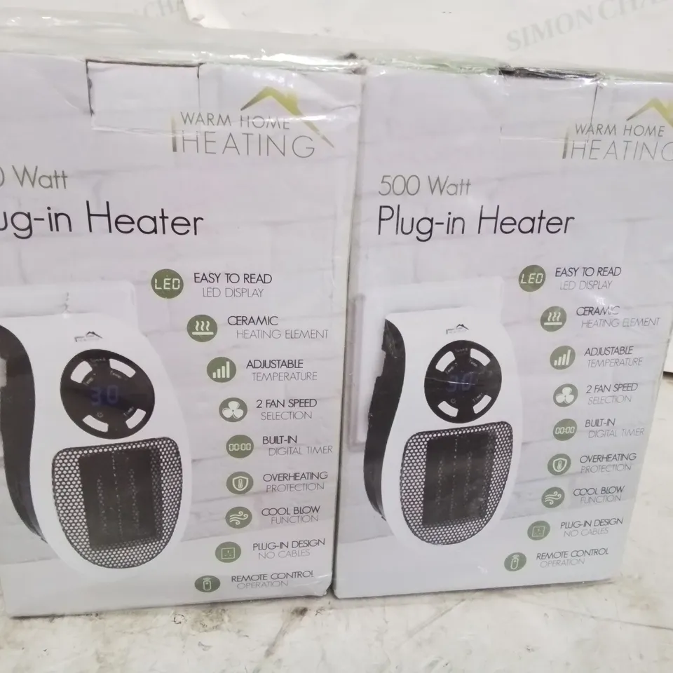 TWO BOXED 500 WATT PLUG IN HEATERS 