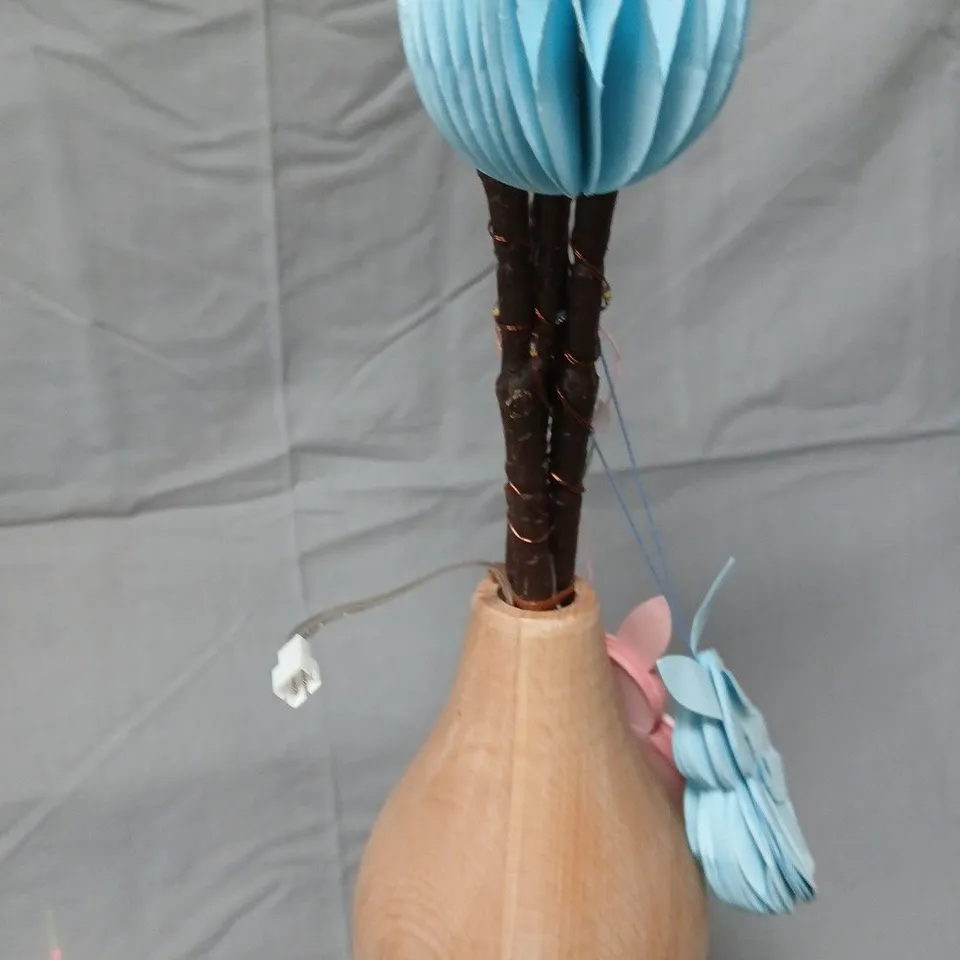 Decorative twig tree in wooden vase with pastel honeycomb ornaments