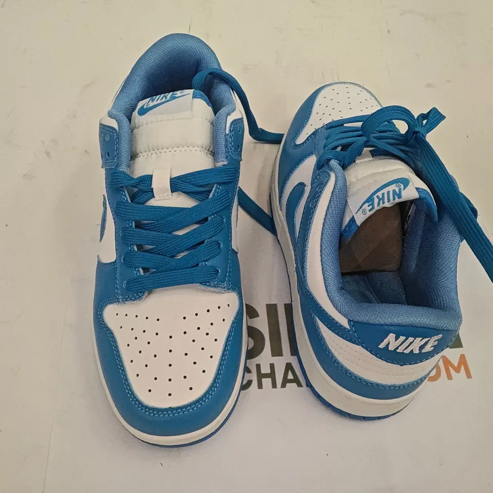 PAIR OF NIKE TRAINERS IN WHITE.BLUE - UK 5.5