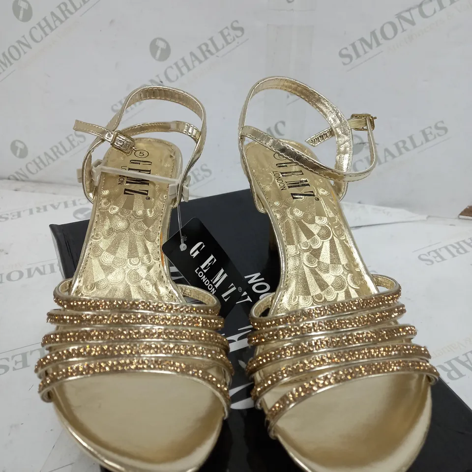 BOX OF APPROXIMATELY 5 GEMZ LONDON GOLD GEM HEELS 