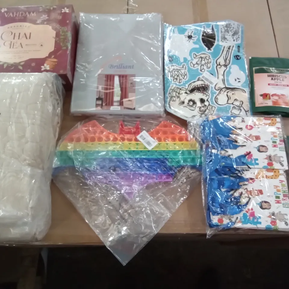 PALLET OF ASSORTED ITEMS INCLUDING VAHDAM HIBISCUS APPLE ICED TEA, BATMAN FIDGET TOY, BRILLIANT CURTAINS, HALLOWEEN WINDOW STICKERS, QUILTED BEDSPREAD, VAHDAM CHAI TEA
