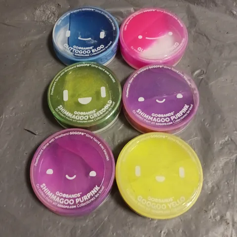 BOX OF APPROXIMATELY 100 GOOBAND SLIME TOYS IN ASSORTED COLOURS