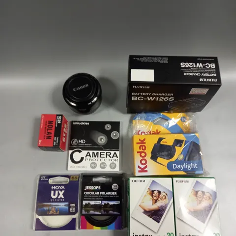 APPROXIMATELY 15 ASSORTED CAMERA PRODUCTS AND ACCESSORIES TO INCLUDE LENS, FILM, CHARGERS ETC