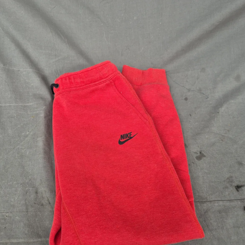 NIKE RED JOGGERS WITH SWOOSH LOGO - SIZE L - KIDS