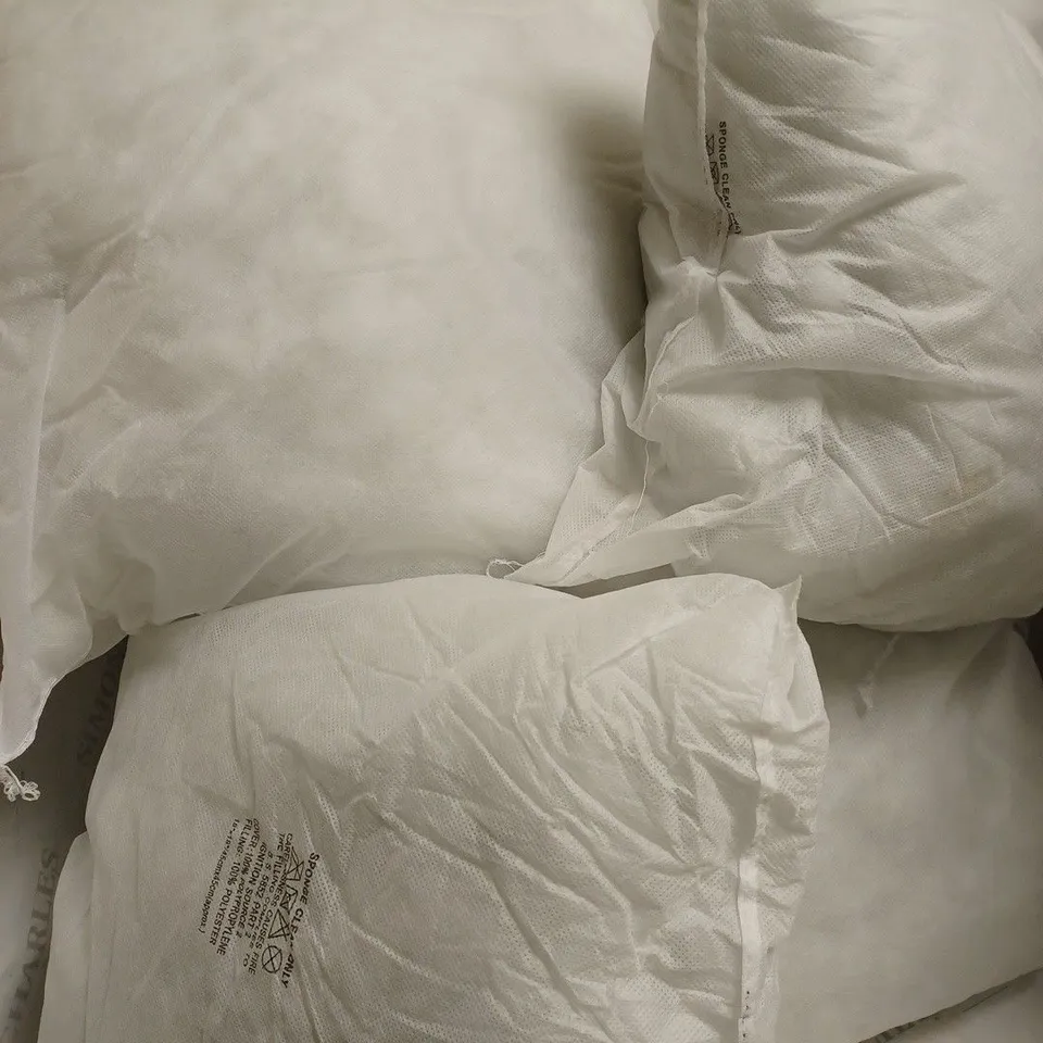 5 PILLOWS WITHOUT PILLOWCASES 