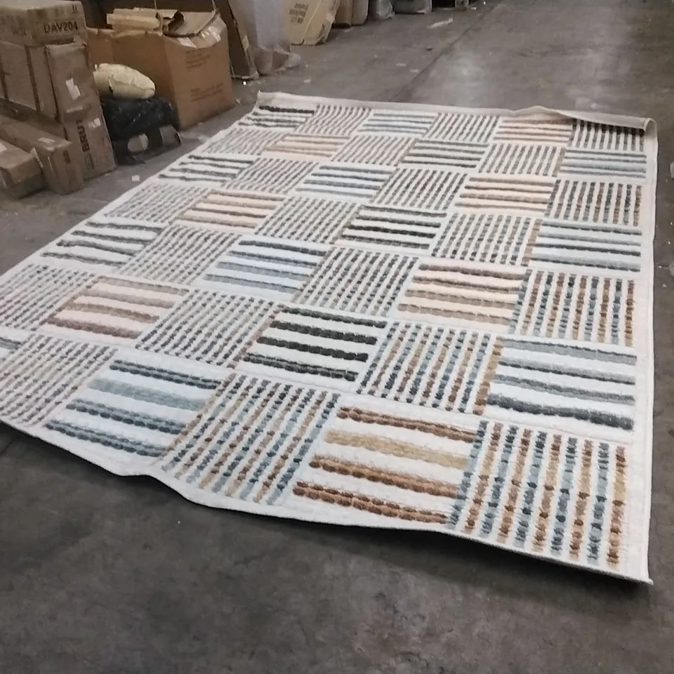 STILLAGE OF APPROXIMATELY 20 DESIGNER RUGS