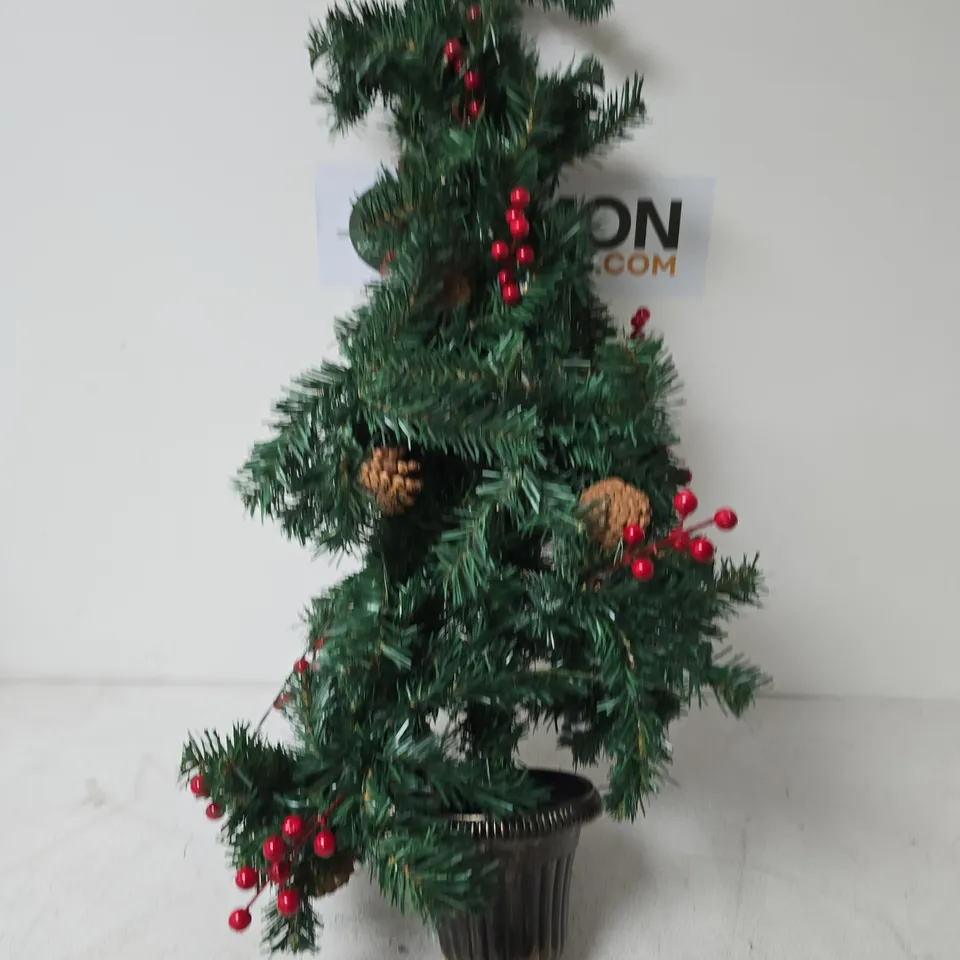 ARTIFICIAL CHRISTMAS TREE IN POT WITH RED BERRIES AND PINE CONES