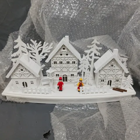 WHITE WOOD LIT VILLAGE SCENE