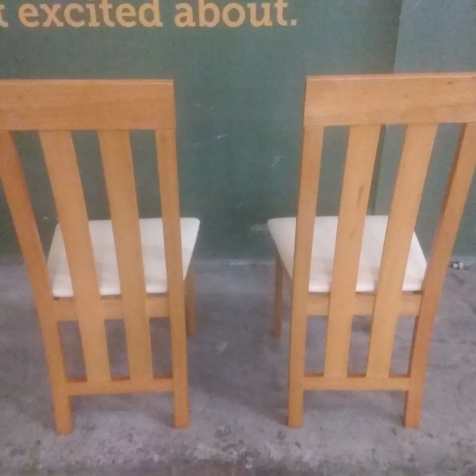 SET OF 2 NEW CHESTER OAK DINING CHAIRS (IVORY LEATHER SEAT PADS)