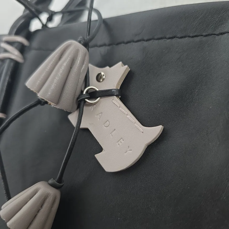 RADLEY BLACK LEATHER HANDBAG WITH TASSEL CHARMS AND CROSSBODY STRAP