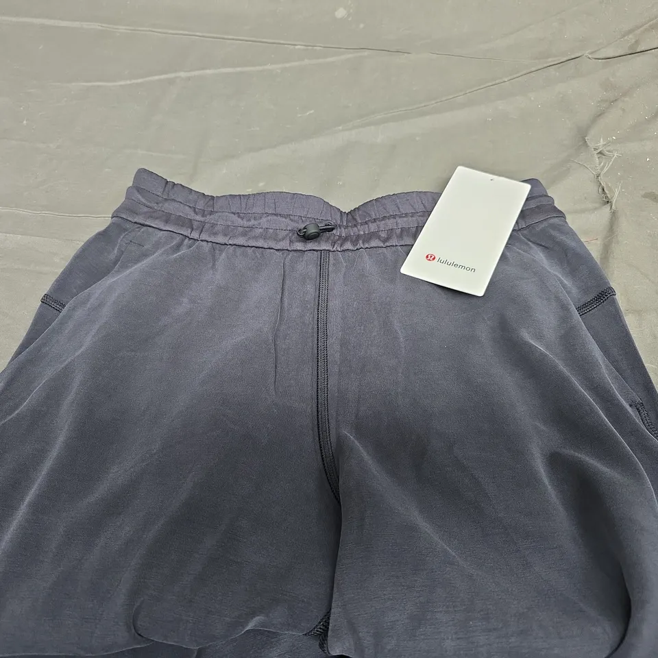 LULULEMON SOFTSTREME HIGHT RISE PANT REGULAR IN NAVY SIZE 31"