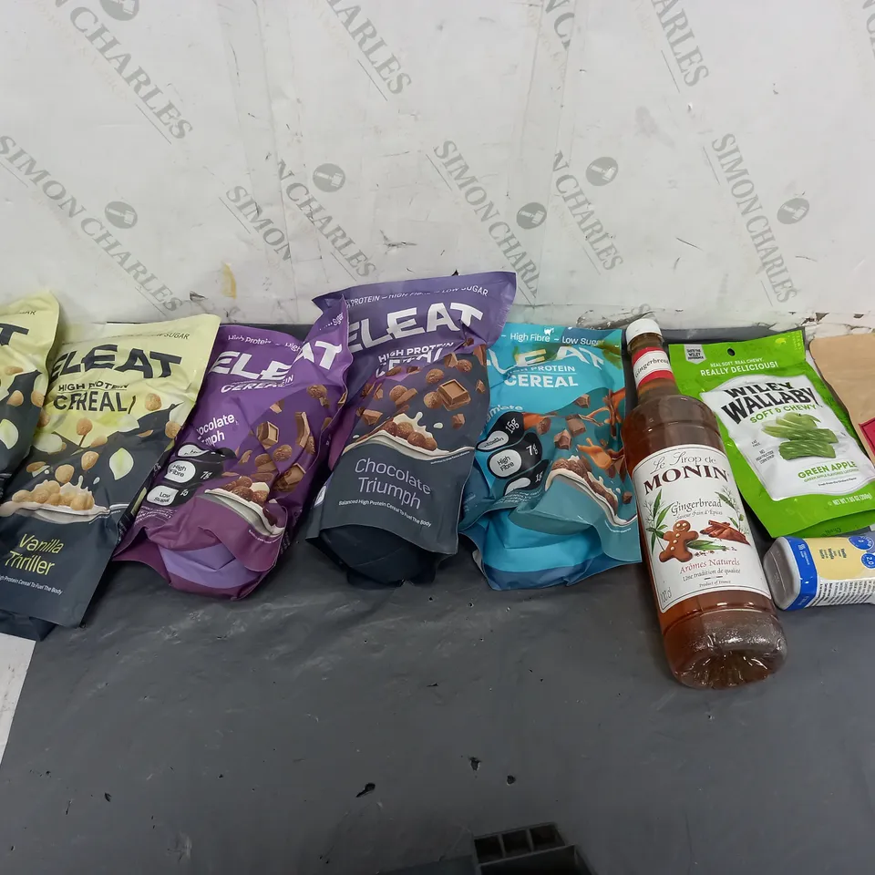 APPROXIMATELY 8 ASSORTED FOOD ITEMS TO INCLUDE - ELEAET PROTEIN CEREAL, MONIN CARAMEL, AND SOFT GREEN APPLE SWEATS ETC. 