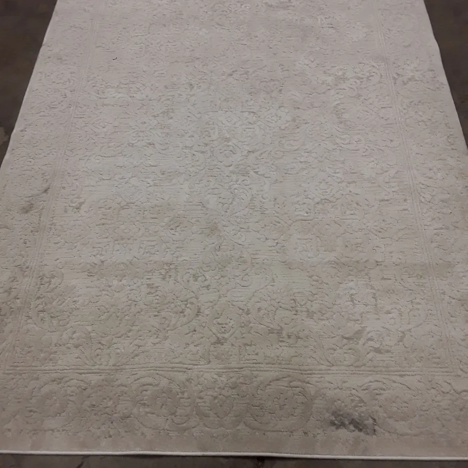 CREAM-COLOURED ORNATE-PATTERN RUG 215X155CM APPROXIMATELY