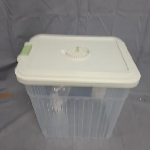 CLEAR PLASTIC STORAGE BOX WITH WHITE LID AND GREEN LATCH