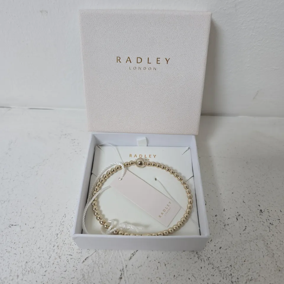 BOXED RADLEY 18CT GOLD PLATED BEAD HINGED BANGLE