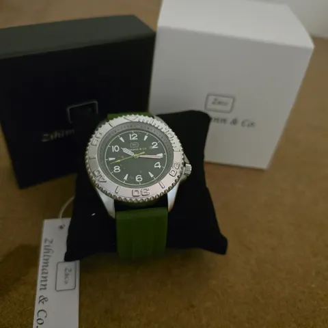 ZIHLMANN AND CO GREEN DIAL WRISTWATCH WITH SILVER CASE AND GREEN SILICONE STRAP – BOXED