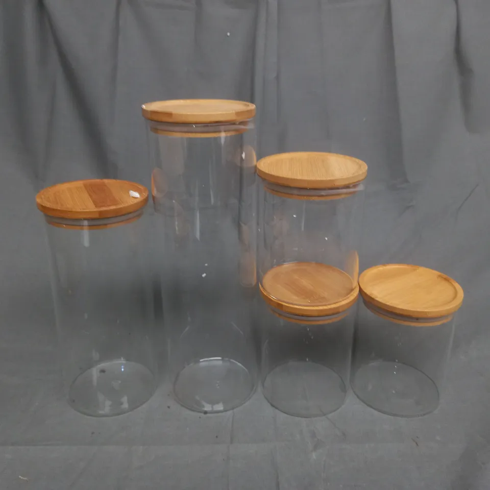 BOX OF 5 GLASS CAINSTERS IN VARIOUS SIZES