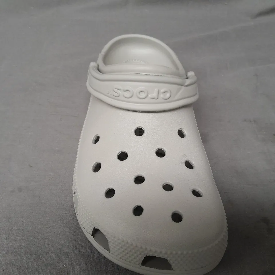 PAIR OF CROCS CLASSICS IN GREY UK SIZE M6/W7