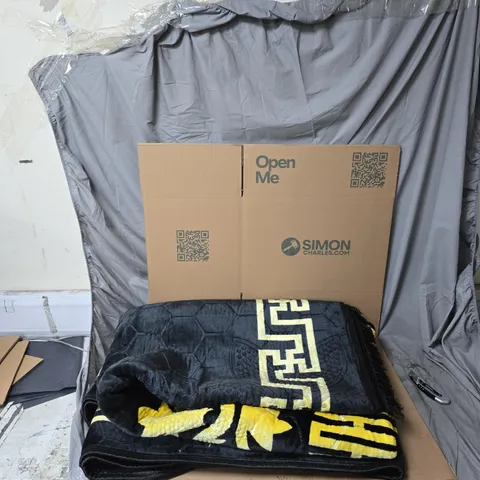 LARGE BLACK AND GOLD PATTERNED RUG 