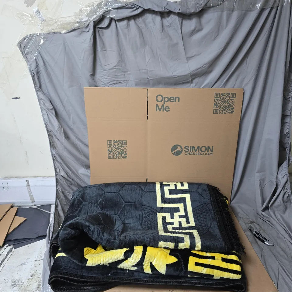 LARGE BLACK AND GOLD PATTERNED RUG