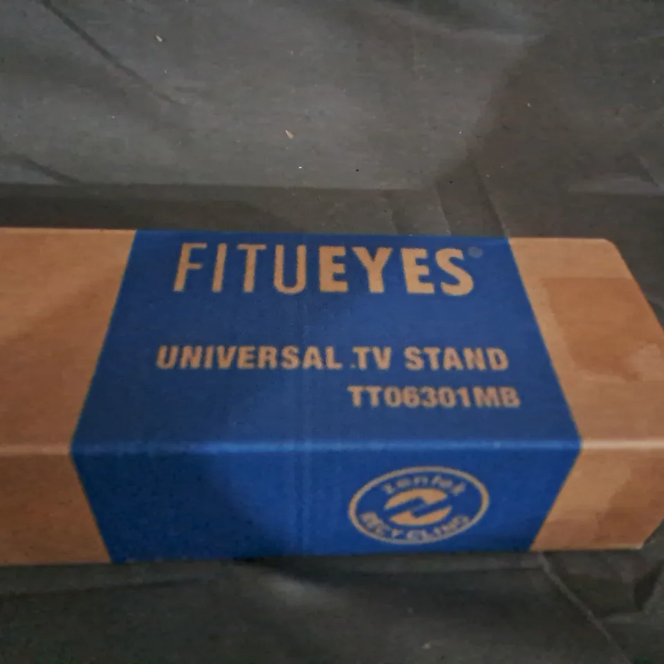 BOXED FITUEYES UNIVERSAL TV STAND- TT06301MB