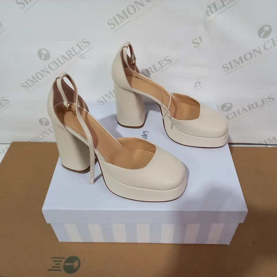 BOXED PAIR OF RUSSELL & BROMLEY CREAM HIGH HEELS SIZE 37