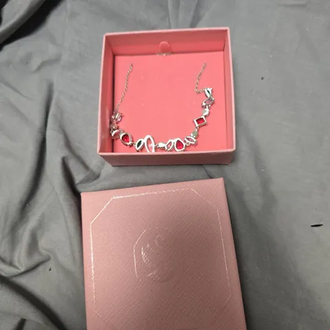 SILVER-TONE NECKLACE WITH GEOMETRIC RED GEMSTONE ACCENTS – IN PINK PRESENTATION BOX