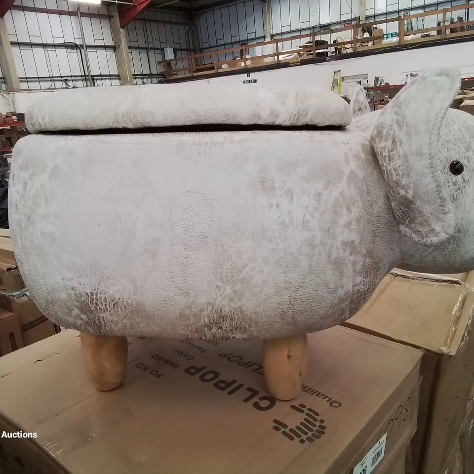 A FAUX LEATHER UPHOLSTERED ANIMAL THEMED OTTAMAN/POUFFE 