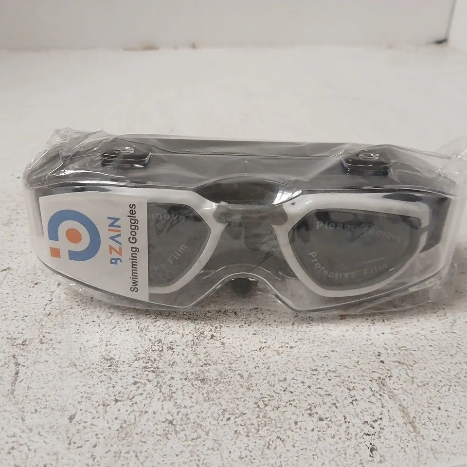 BZAIN WHITE-FRAME SWIMMING GOGGLES IN SEALED PLASTIC PACKAGING