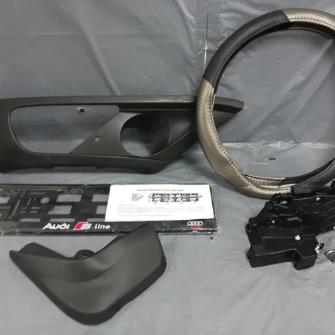FIVE ASSORTED CAR PARTS TO INCLUDE; VOLVO V50 DOOR LOCK, AUDI S-LINE LICENCE PLATE HOLDER AND STERRING WHEEL COVER