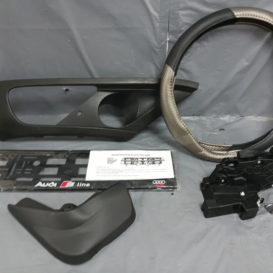 FIVE ASSORTED CAR PARTS TO INCLUDE; VOLVO V50 DOOR LOCK, AUDI S-LINE LICENCE PLATE HOLDER AND STERRING WHEEL COVER