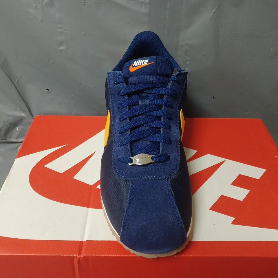 BOXED PAIR OF NIKE CORTEZ TRAINERS IN NAVY/YELLOW - UK 7.5