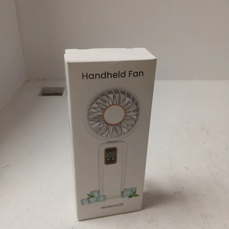 APPROXIMATELY 10 ASSORTED ITEMS INCLUDING HANDHELD FAN AND WIRELESS SPEAKER