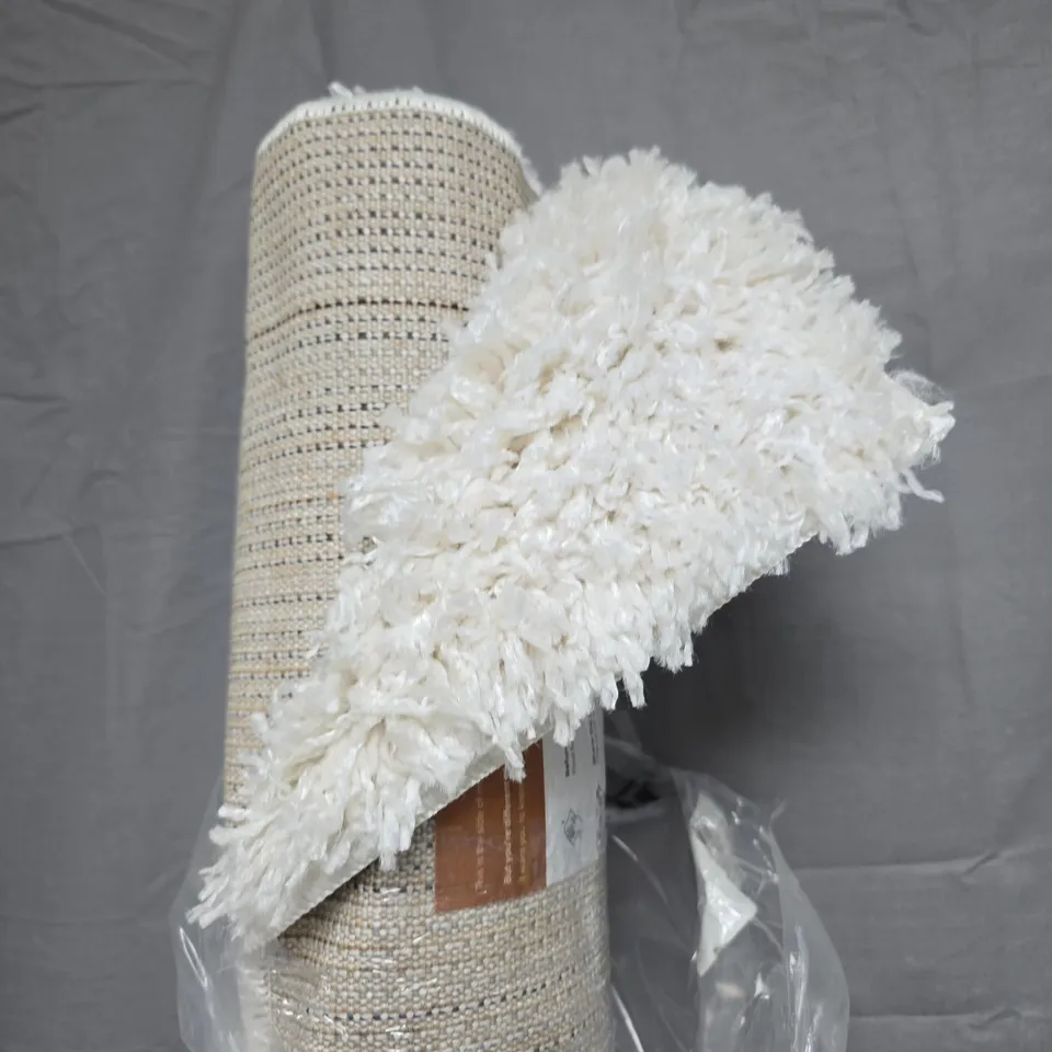 BEIGE WOVEN RUG WITH WHITE SHAG FRINGE EDGE