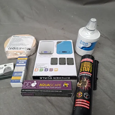 APPROXIMATELY 15 ASSORTED HOUSEHOLD PRODUCTS TO INCLUDE VIBRATION ALARM, ADHESIVE, DIGITAL SCALES ETC