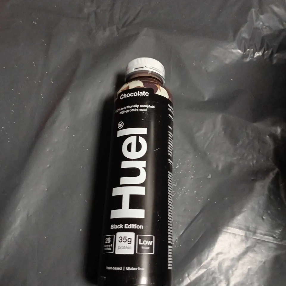 APPROXIMATELY 11 ASSORTED FOOD AND DRINK ITEMS INCLUDING HOTEL CHOCOLAT ADVENT CALENDAR . GREEN CHILLI SAUCE AND HUEL CHOCOLATE DRINK