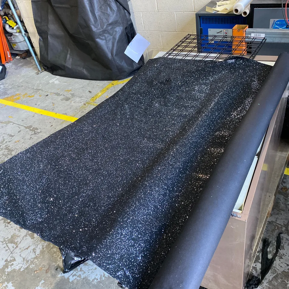 ROLL OF BLACK GLITTERY FABRIC