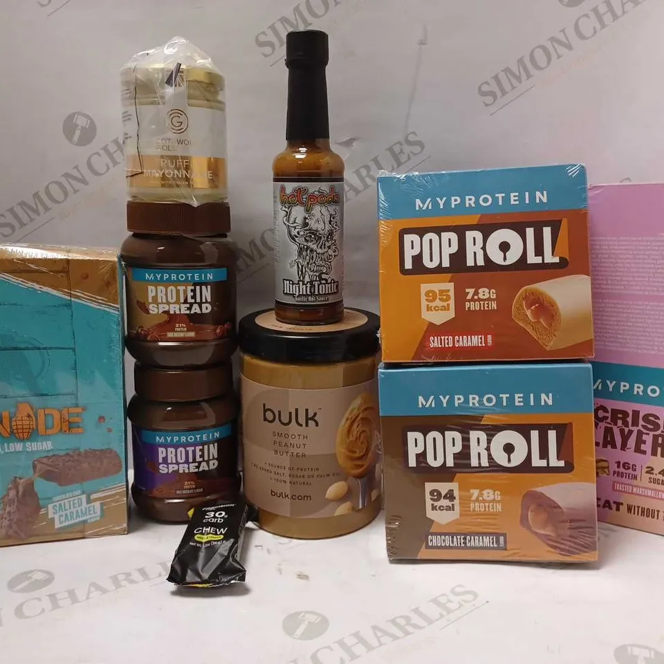 LOT OF APPROX 9 ASSORTED FOOD ITEMS TO INCLUDE GRENADE SALTED CARAMEL BARS, PROTEIN SPREAD CHOC HAZELNUT, HOT PODS NIGHT TONIC GARLIC HOT SAUCE, ETC 
