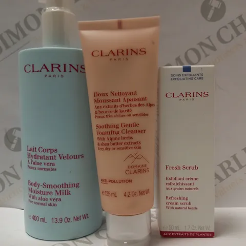 LOT OF 3 ASSORTED CLARINS PRODUCTS TO INCLUDE MOISTURE MILK, FOAMING CLEANSER, REFRESHING CREAM SCRUB