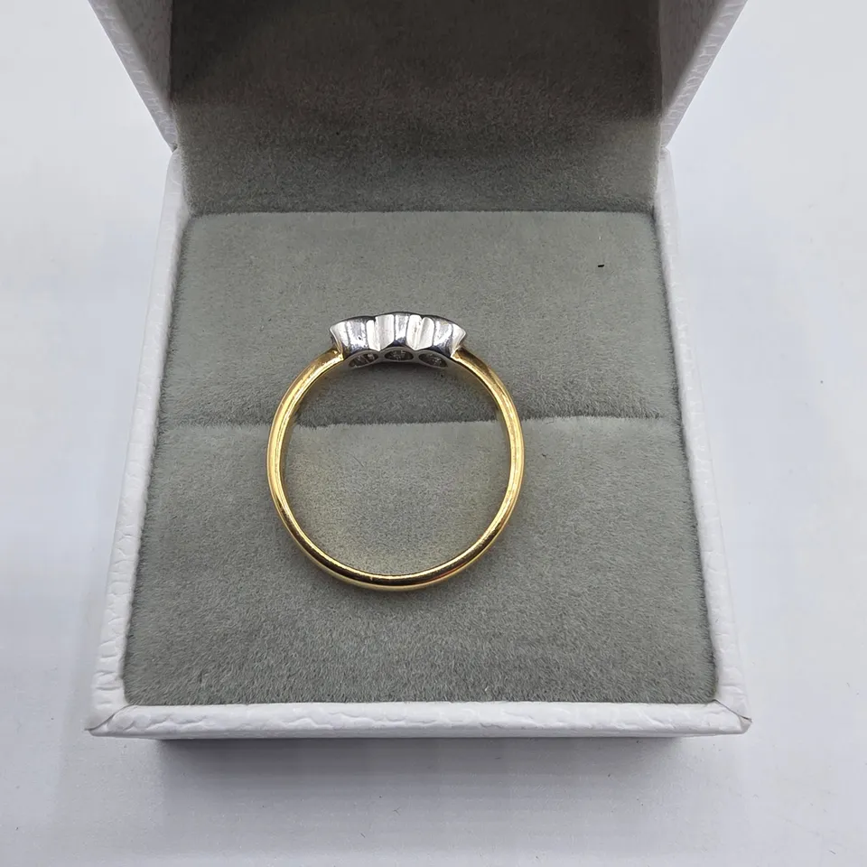 18CT GOLD THREE STONE RING RUB-OVER SET WITH NATURAL DIAMONDS