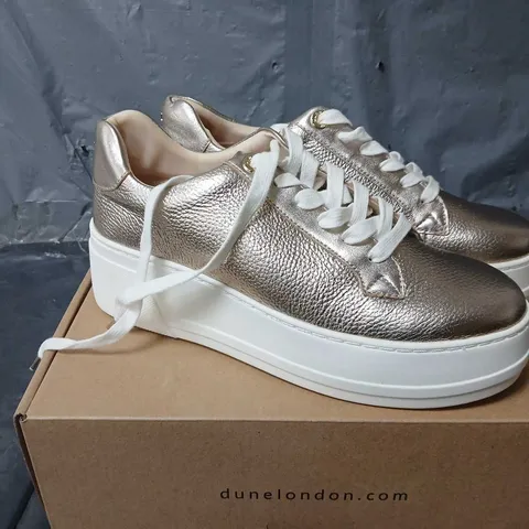 BOXED PAIR OF DUNE LONDON FLATFORM LACE UP SPORT TRAINERS IN GOLD - SIZE 6