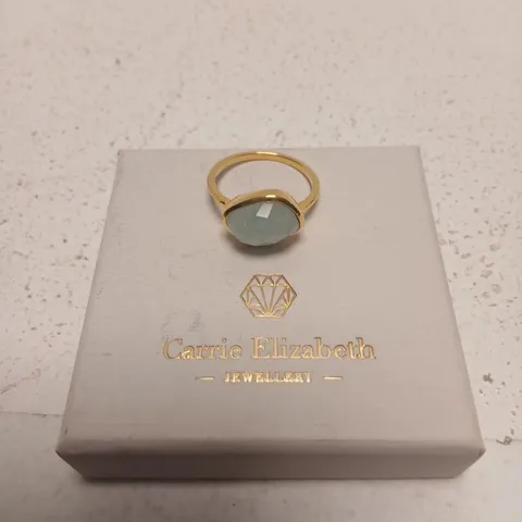 CARRIE ELIZABETH JEWELLERY GOLD-TONE RING WITH PALE BLUE GEMSTONE