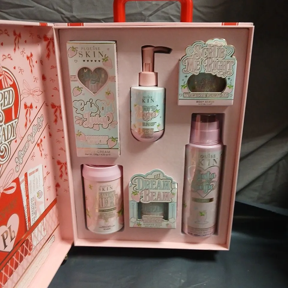 PLOUISE WRAPPED & READY WHEELED SUITCASE SKINCARE GIFT SET