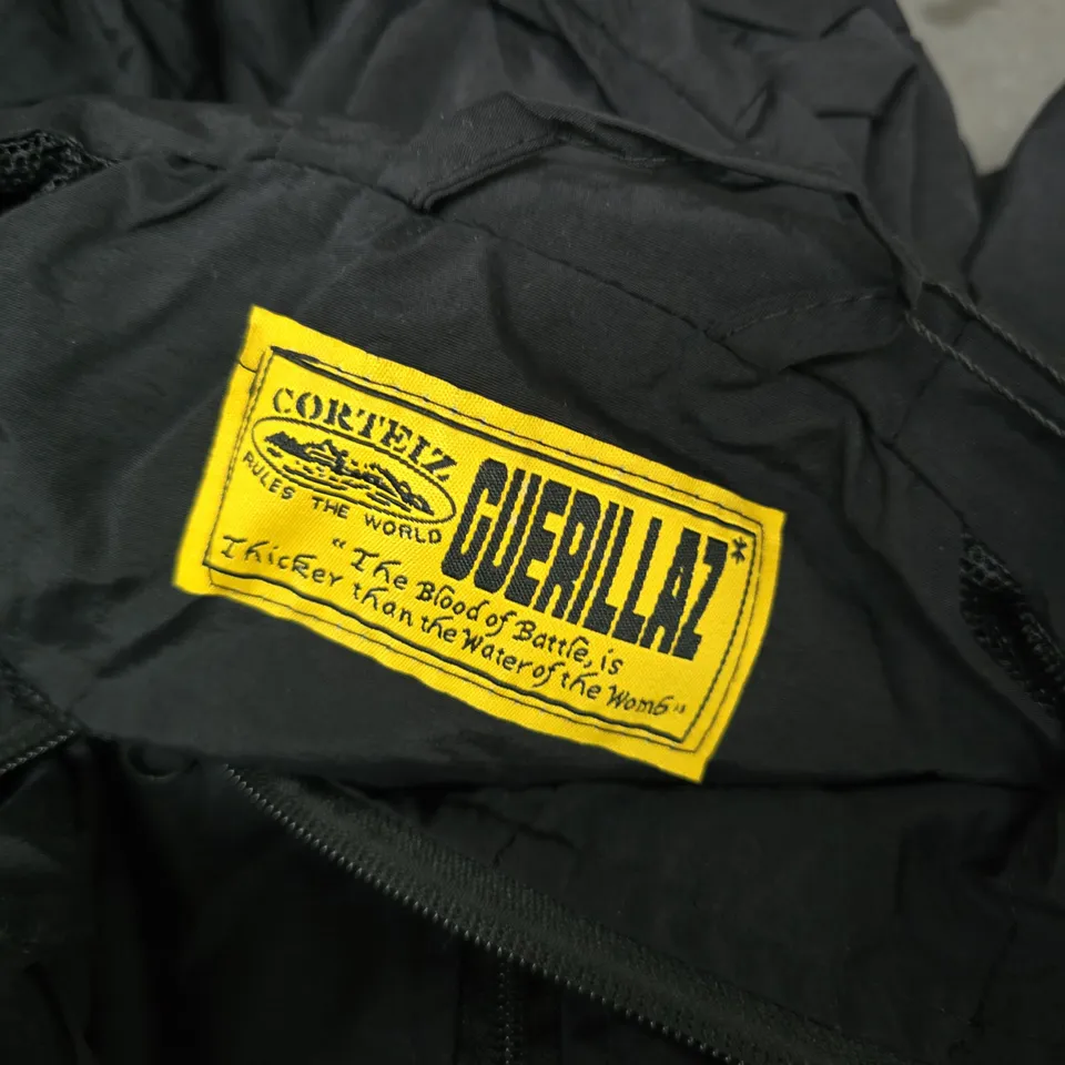 CORTEIZ HOODED WINDBREAKER JACKET – BLACK WITH GREY SIDE PANELS - SIZE UNSPECIFIED