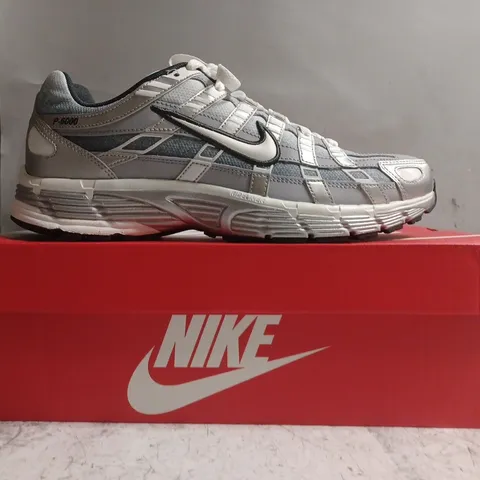 BOXED PAIR OF NIKE P-6000 TRAINERS IN METALLIC SILVER SIZE UK 9