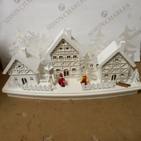 WHITE WOOD LIT VILLAGE SCENE